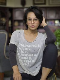 Portrait of young woman standing in gym