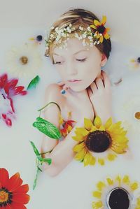 Close-up of woman holding flowers