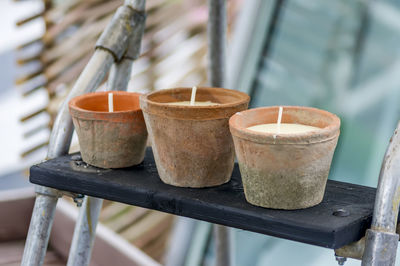 Close-up of candles on ladder