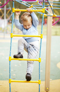 Boy playing in playground