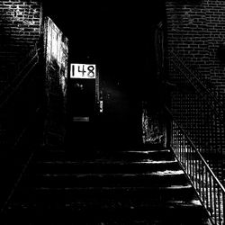 Illuminated walkway at night