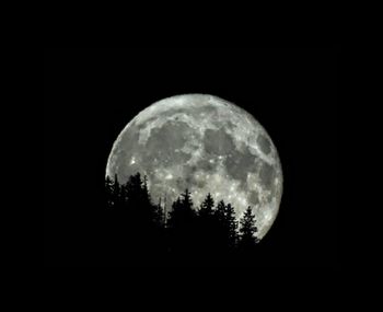 Scenic view of moon against sky at night