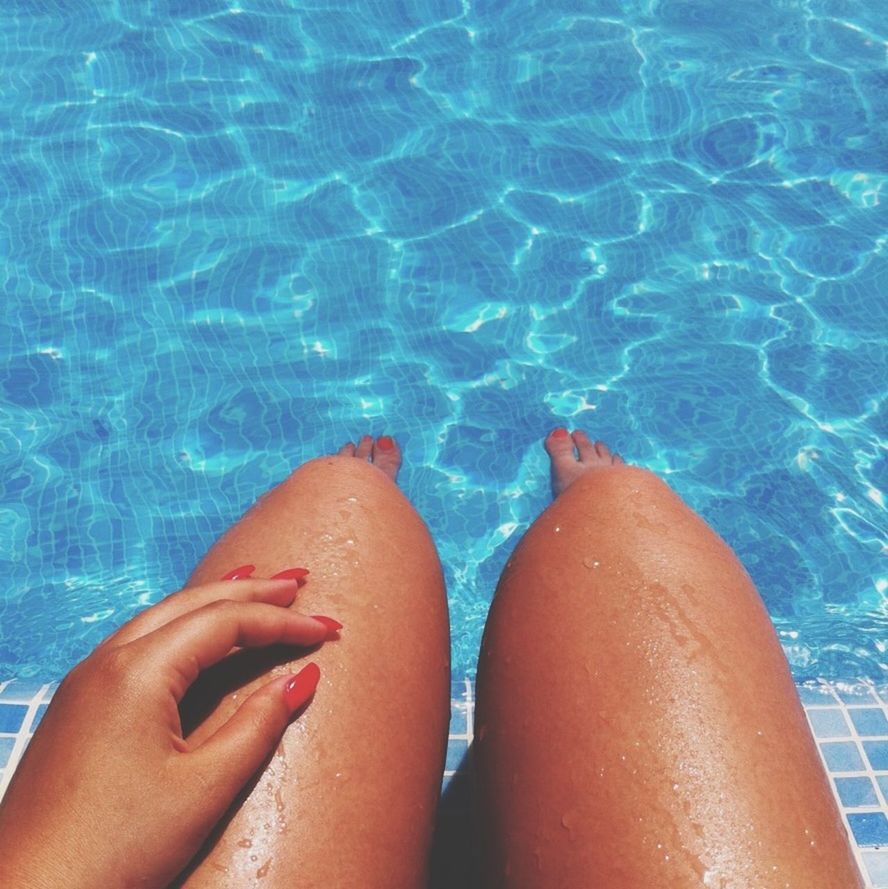 water, personal perspective, low section, person, swimming pool, part of, lifestyles, blue, leisure activity, barefoot, high angle view, human foot, refreshment, unrecognizable person, turquoise colored