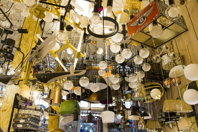 Low angle view of illuminated lanterns hanging in store