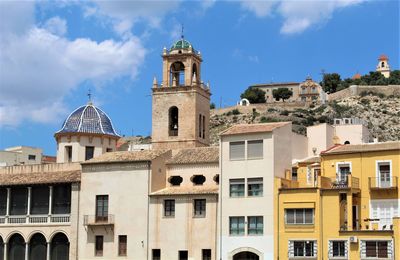 Buildings in city against sky