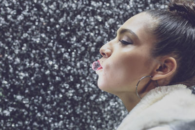 Woman carrying crystal in mouth