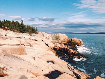 Scenic view of sea against cloudy sky