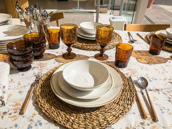 Modern table set in home style boutique, ceramic crockery stuck plates, designed cutlery