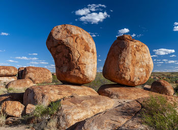 Low angle view of rock formation against sky