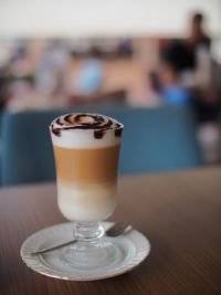 Close-up of coffee served on table at cafe