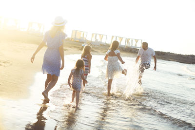 Family playing on beach