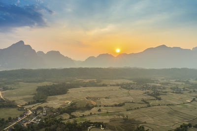 Scenic view of landscape against sky during sunset