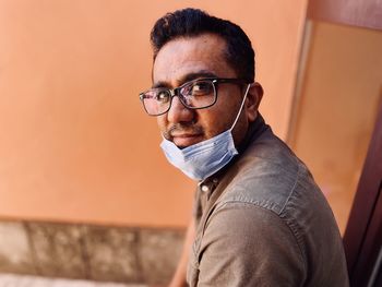 Face closeup portrait of asian man with mask