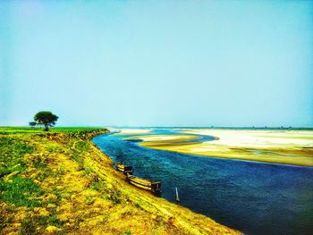 Scenic view of calm sea against clear sky