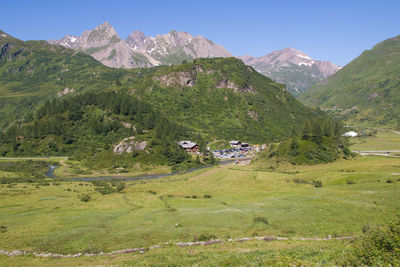 Scenic view of landscape and mountains against sky