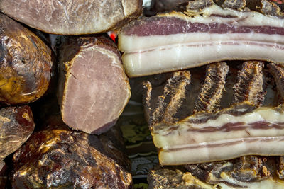 Exposed bacon and dried meat products. the products are domestic and are presented for sale.