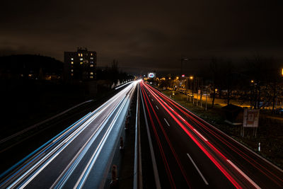 High angle view of light trails on road at night