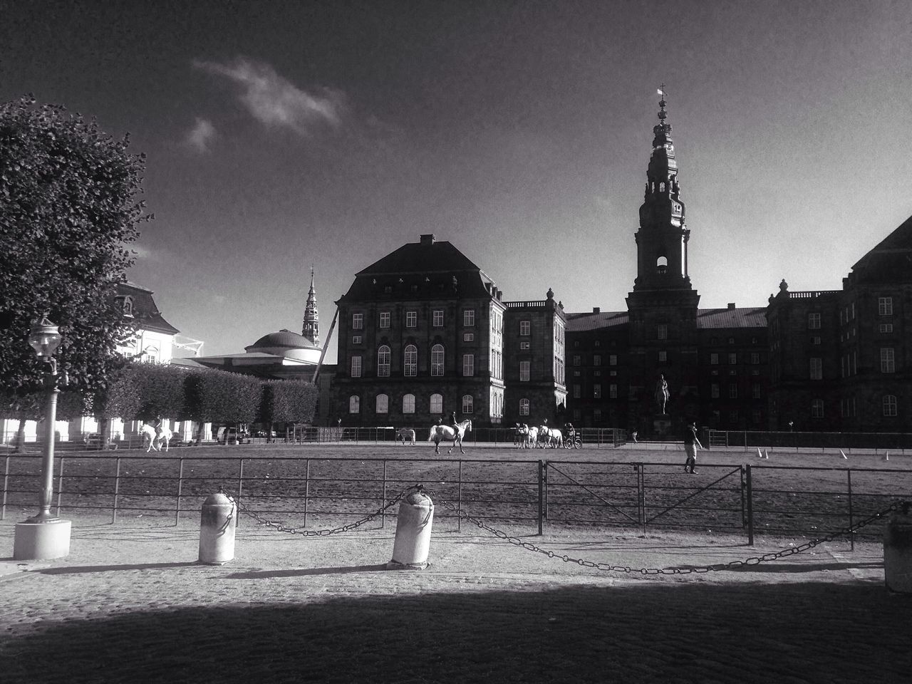 architecture, building exterior, built structure, tree, sky, railing, lawn, outdoors, history, cloud, footpath, facade, spire, day, the past, old town, no people, tranquil scene, tranquility