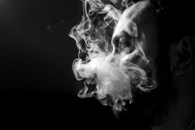 Close-up of smoke against black background