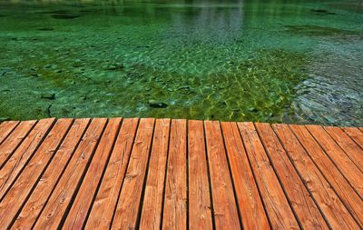 High angle view of wooden boardwalk over lake