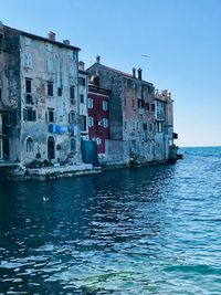 View of sea against buildings