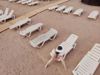 High angle view of chairs on table