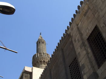 Low angle view of buildings against blue sky