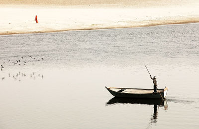 Man on boat in yamuna river
