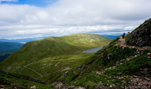 Scenic view of mountains against cloudy sky