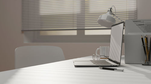 Close-up of laptop on desk