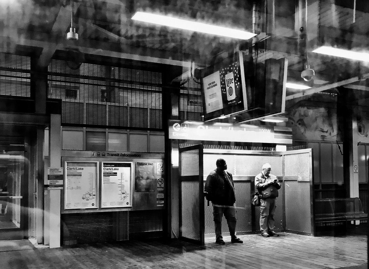 two people, real people, full length, men, illuminated, walking, women, built structure, rear view, indoors, architecture, standing, lifestyles, night, building exterior, vending machine, young adult, adult, people