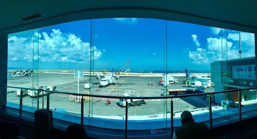 Panoramic view of airport seen through window