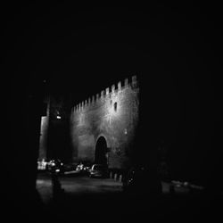 Woman in dark room