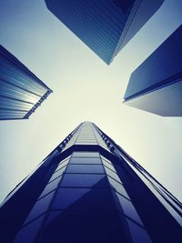 Low angle view of skyscraper against clear blue sky