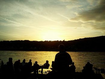 Silhouette of people at sunset