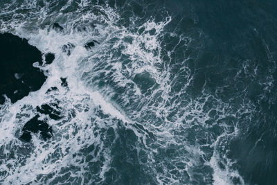 High angle view of water splashing in sea