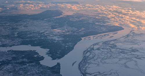 Aerial view of snowcapped mountain against sky