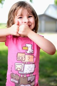 Cute girl holding camera