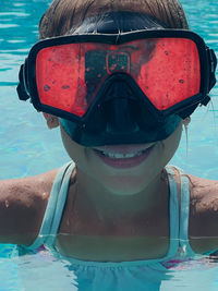 Girl swimming in sea in swimming mask