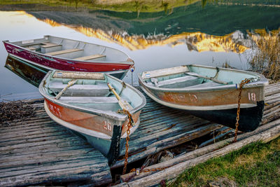 Fishing boats moored on shore at beach