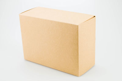 Close-up of paper box against white background