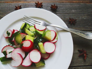 High angle view of fruits in plate on table