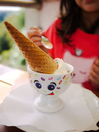 Close-up of ice cream cone on table