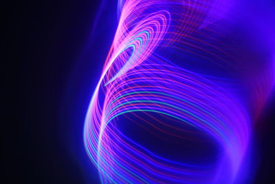 Full frame shot of light painting against black background