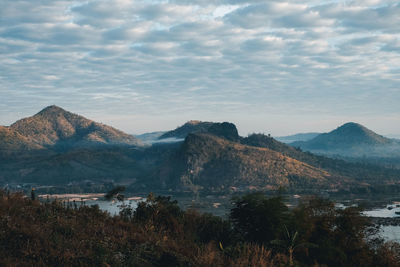 Scenic view of lake and mountains against sky