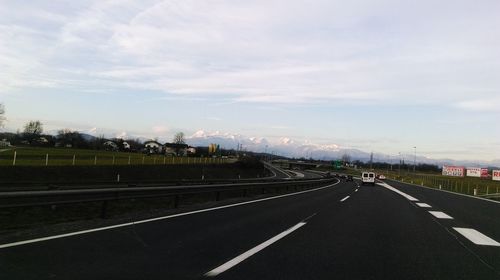 Empty road along landscape