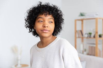 Portrait of young woman looking away