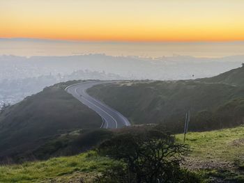 Scenic view of landscape against sky during sunset