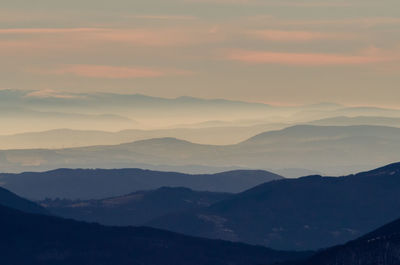 Scenic view of mountains against sky during sunset