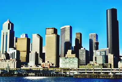 Modern buildings against clear blue sky